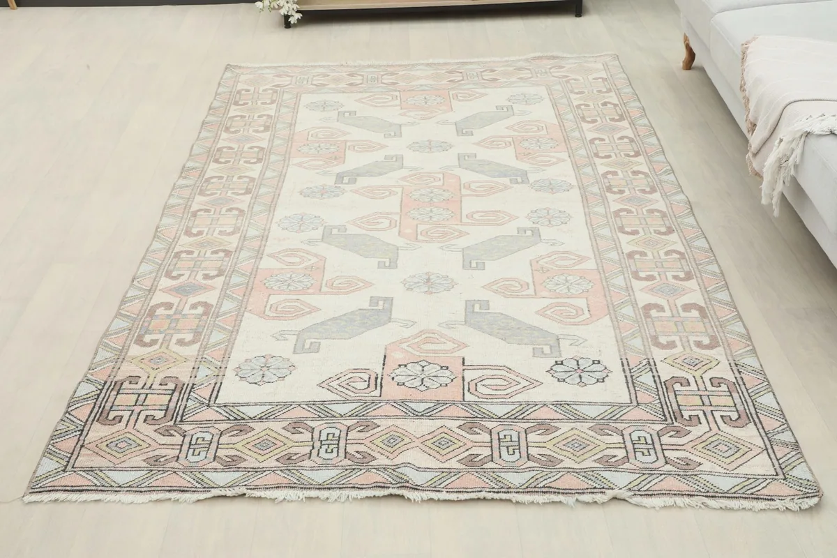 Full overhead view of the 5'1" x 8'3" vintage Anatolian rug laid out in a room