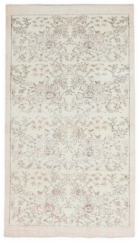 Full top view of the 4'11" x 8'11" ivory vintage Anatolian rug with rose and brown floral patterns