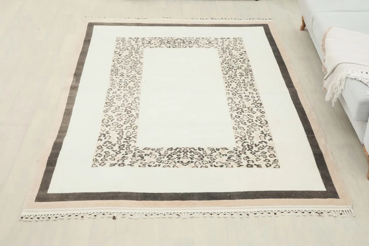 Full room view of the ivory vintage Anatolian rug, showcasing its size and design.