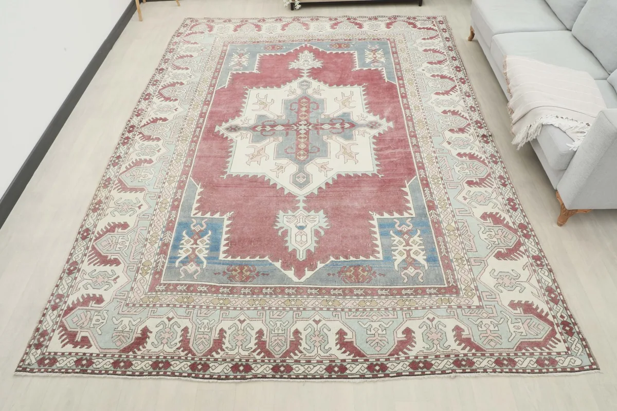 Full view of the 8'4" x 11'0" vintage Anatolian rug laid out in a room, providing a sense of its scale.