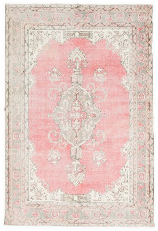 Full top view of the 6'9" x 10'0" vintage Anatolian area rug with a pink field and gray border