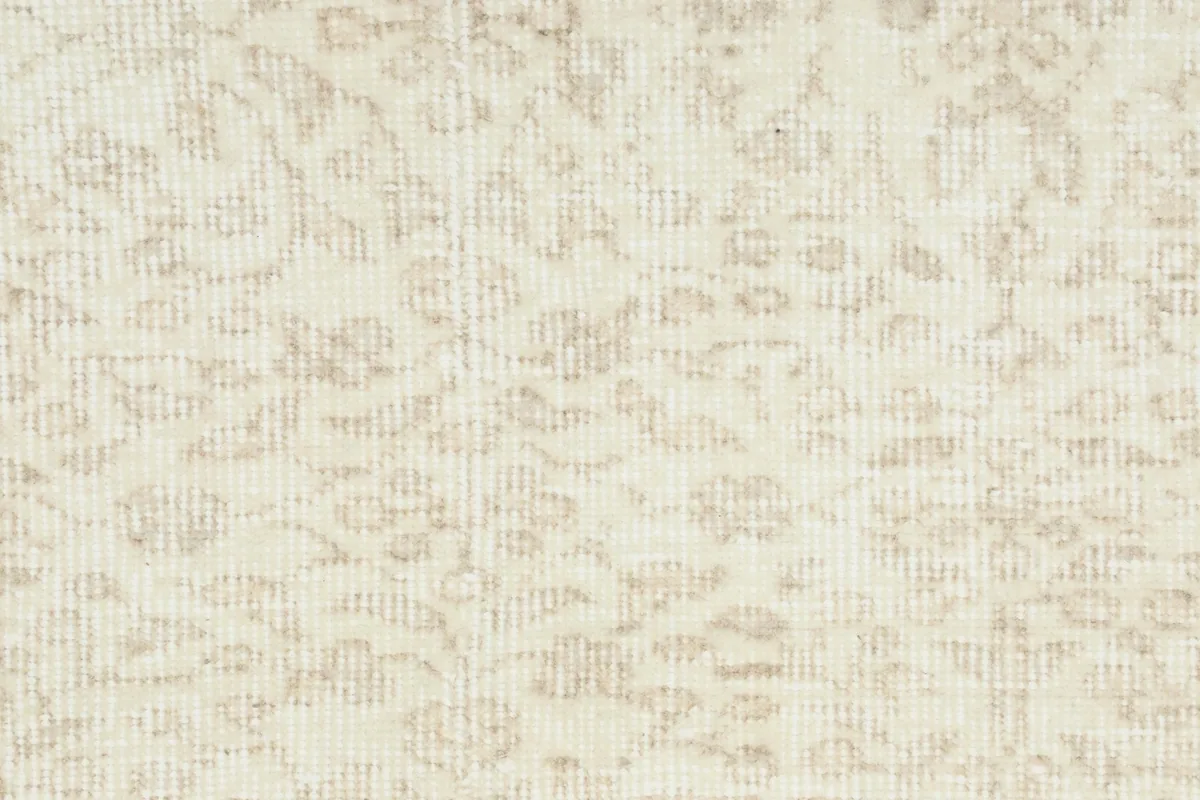 Detailed view showing the texture and subtle wear within the rug's pattern.