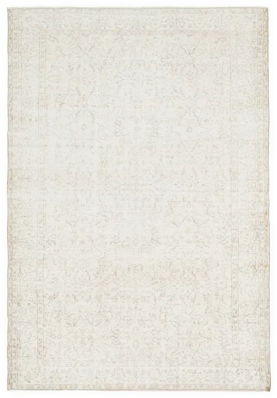 Full top view of the 7x10 ivory vintage Anatolian area rug with subtle floral patterns