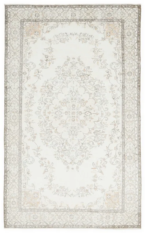 Full top view of the ivory and gray vintage Anatolian area rug with a central medallion