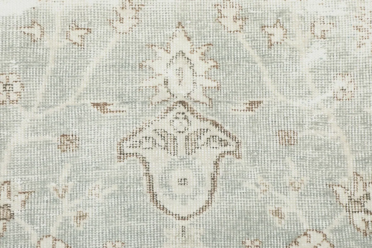 Detailed view of the hand-knotted wool pile, showing individual knots and color blend.