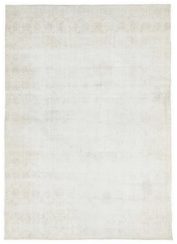 Full overhead view of the 6'11" x 9'11" cream vintage Anatolian rug on a white background