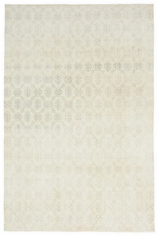 Full top view of the ivory vintage Anatolian area rug with subtle geometric patterns.
