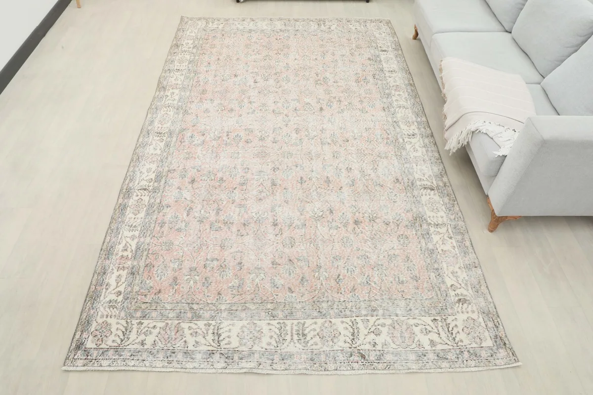 Full view of the 6'4" x 10'3" rug in a room, offering a sense of its scale and presence.