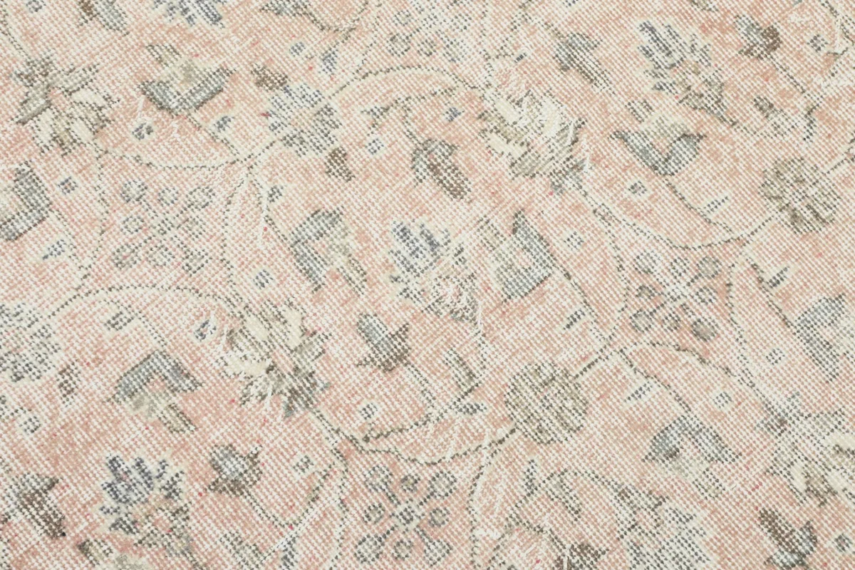 Close-up detail of the rose field with subtle floral and geometric motifs in blue and gray.