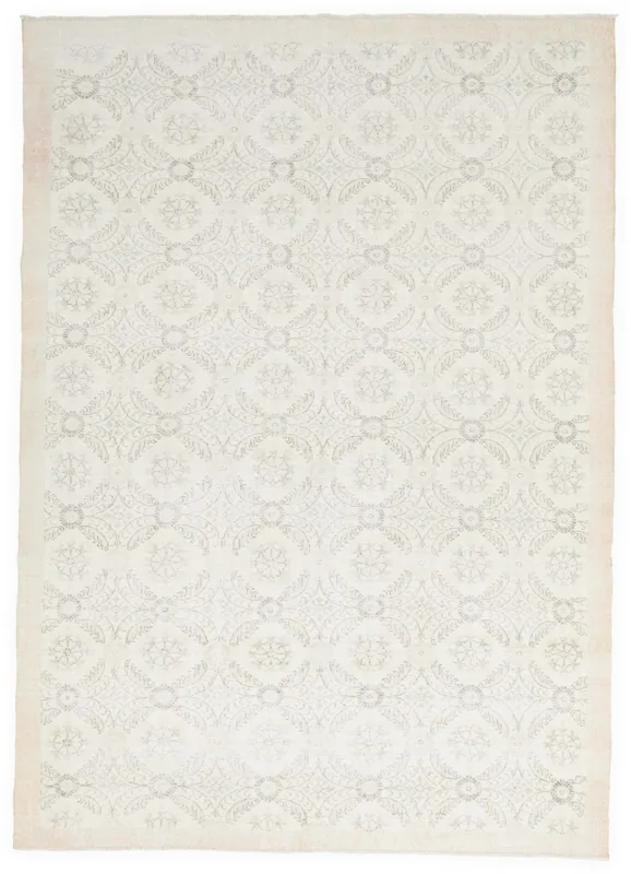 Full top view of the ivory and gray floral geometric vintage Anatolian area rug on a white background.