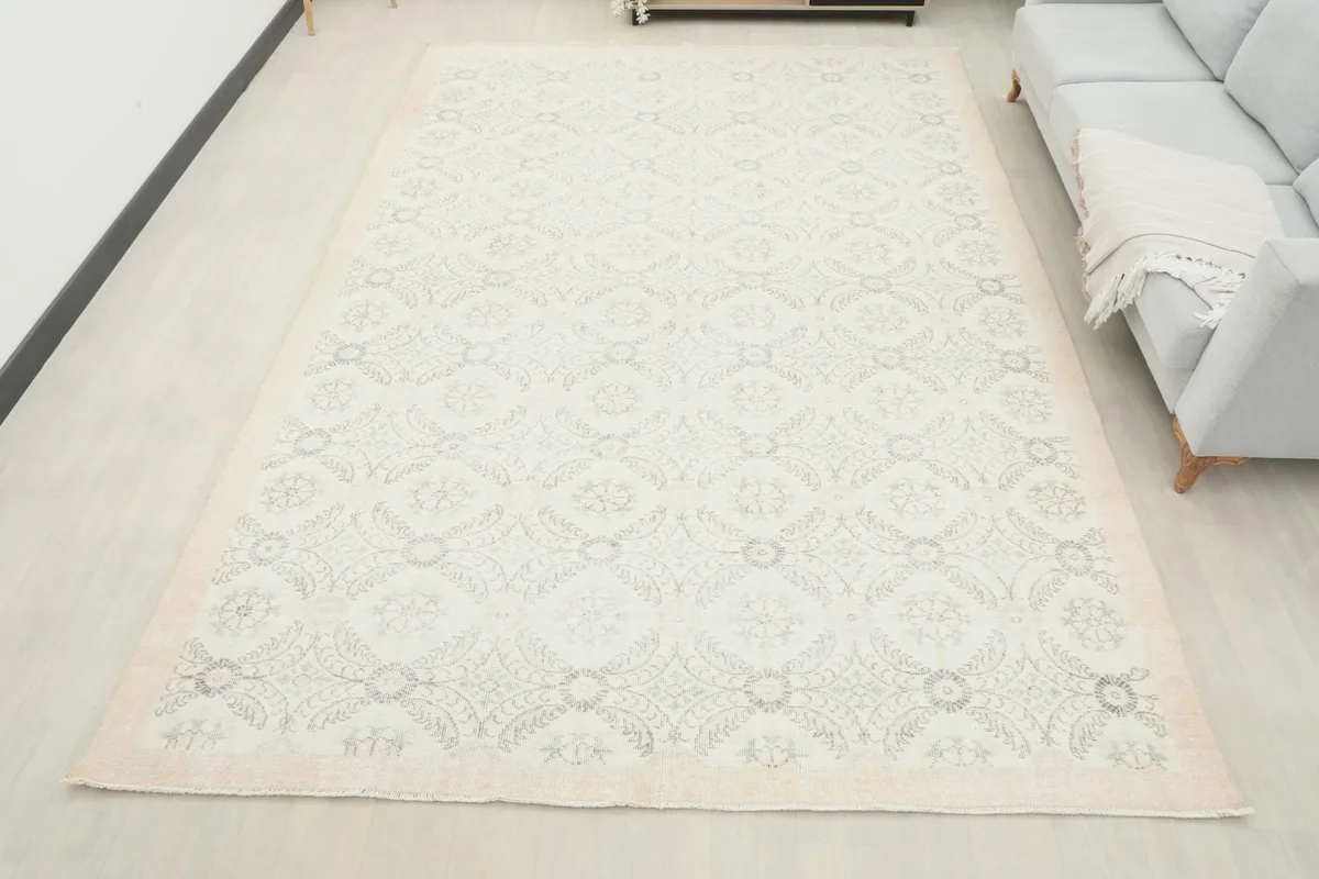 Full overhead view of the ivory and gray vintage Anatolian rug in a living room setup.