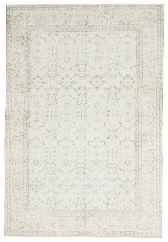 Full overhead view of the ivory hand-knotted vintage Anatolian area rug with subtle beige patterns