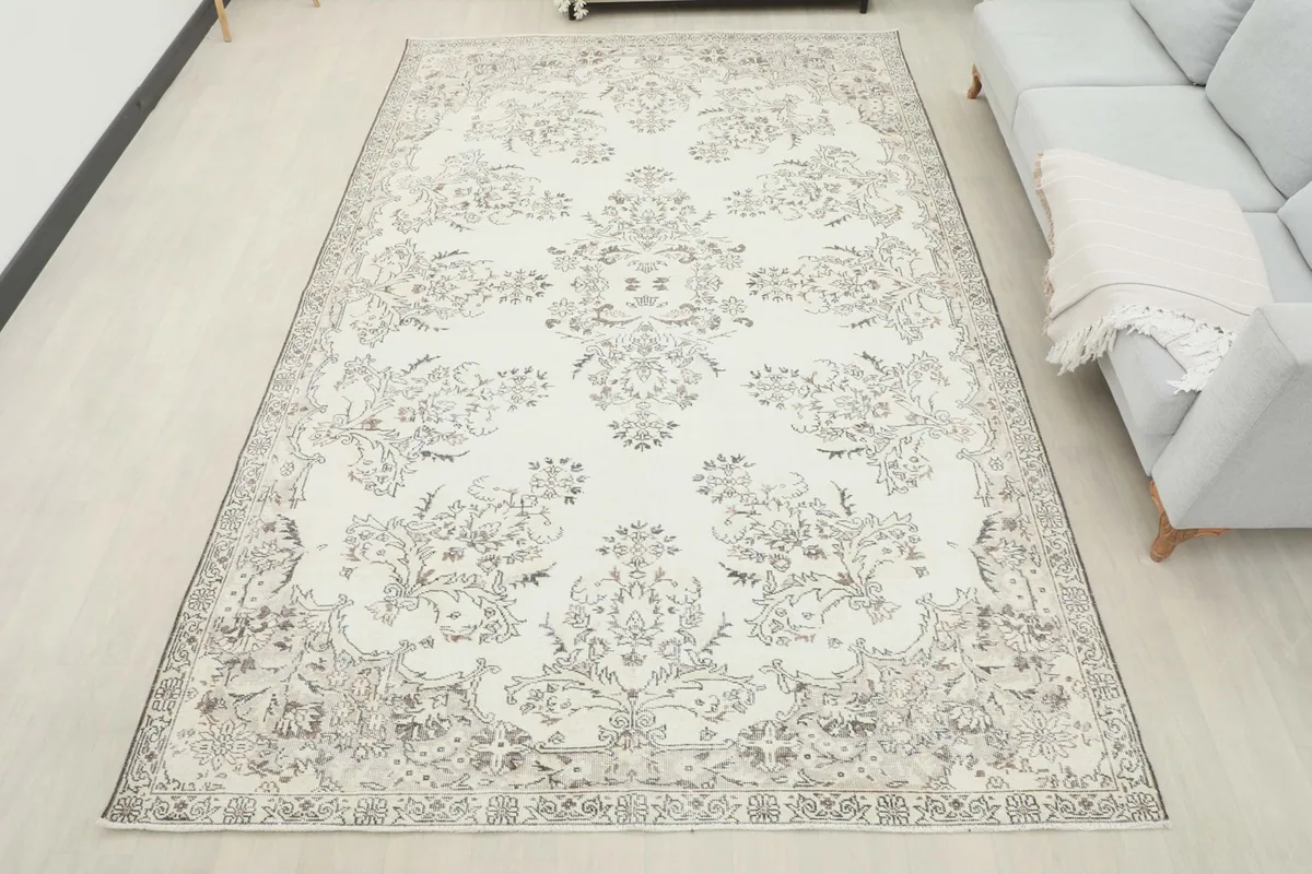 Overhead view of the ivory floral rug in a room, providing a sense of scale and placement