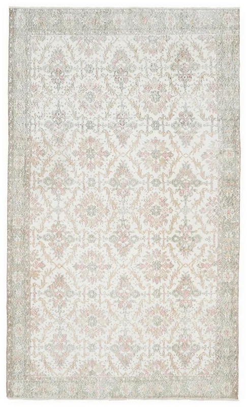 Full overhead view of the ivory, pink, and olive vintage Anatolian rug