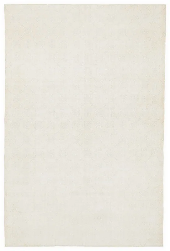 Full top view of the 7'1" x 10'10" ivory vintage Anatolian wool area rug on a white background.