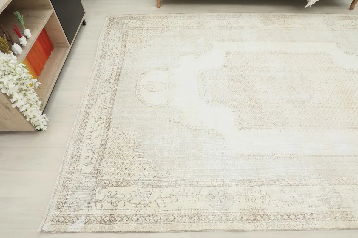 Another angled view of the large rug, focusing on the right side and its soft color variations