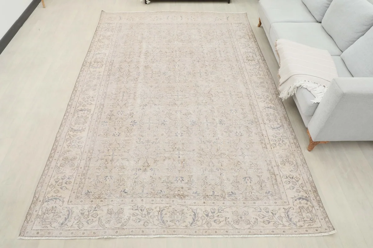 Overhead view of the vintage rug in a living room, showcasing its full design