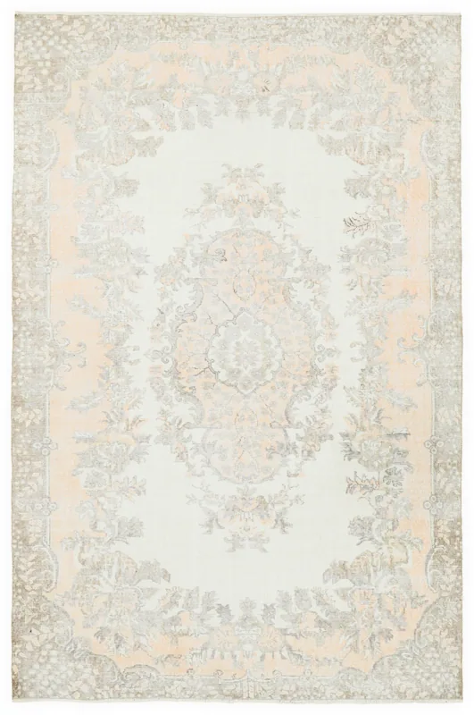 Full overhead view of the 6'4" x 9'7" cream, orange, and gray floral vintage Anatolian rug.