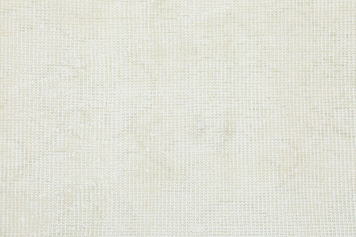Underside of the hand-knotted rug, showing the cotton foundation and intricate knotting.