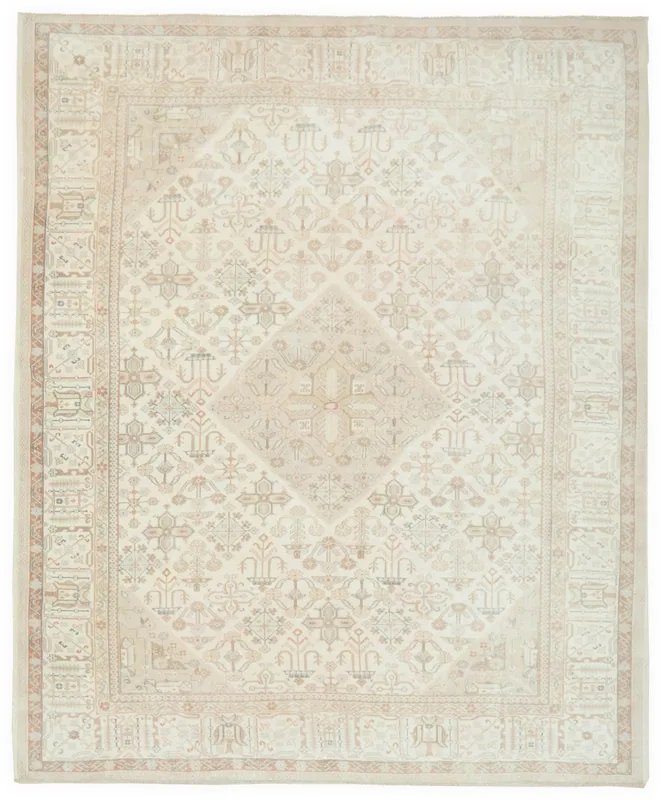 Full overhead view of the 9x10 cream vintage Anatolian rug with geometric medallion.