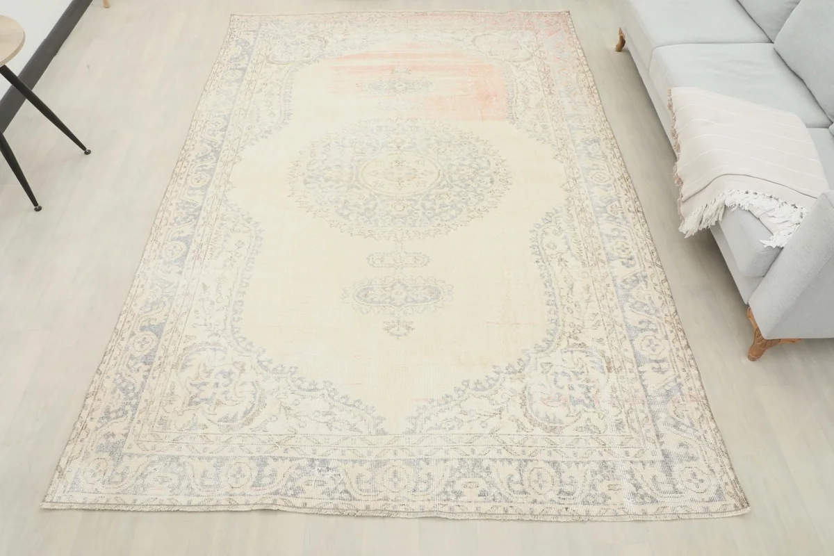 Full room view of the 7x10 cream and gray vintage rug complementing modern home decor