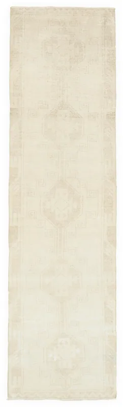 Full overhead view of the 3'4" x 12'9" vintage Anatolian runner rug on a white background.