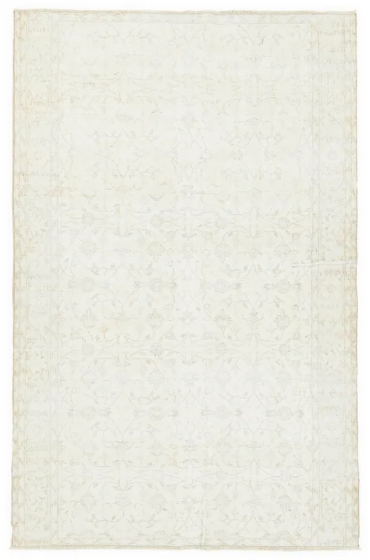 Full top view of the 5'3" x 8'0" ivory floral vintage rug on a white background.