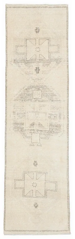 Full top view of the 3'0" x 11'6" ivory and charcoal geometric vintage runner rug on a white background.