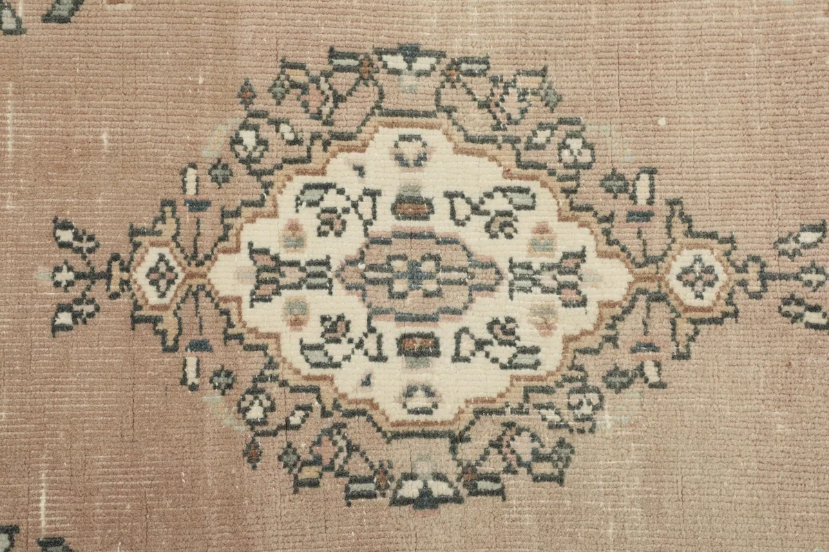 Detailed view of a single geometric medallion, highlighting the intricate design and colors.