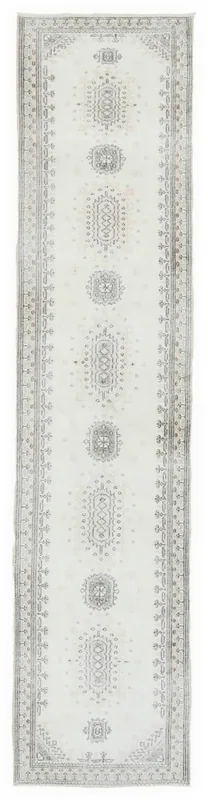 Full overhead view of the 2'10" x 12'11" ivory and gray vintage Anatolian runner rug on a white background.