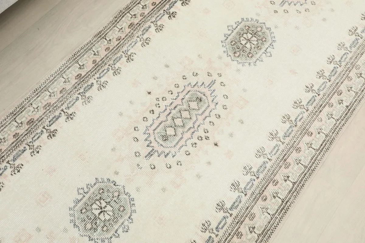 Overhead view of the central section of the runner, showing repeated geometric medallion-like designs.