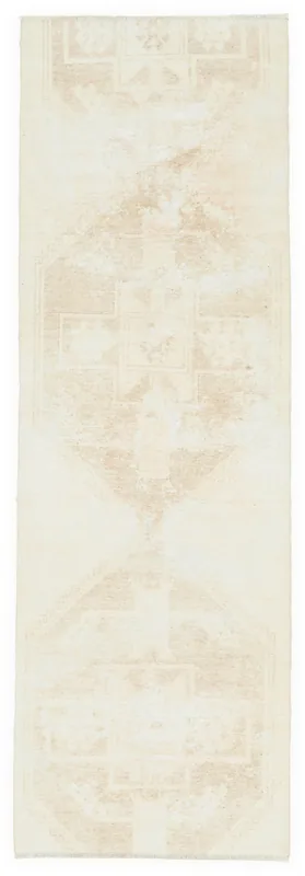 Full top view of a beige and tan geometric vintage runner on a white background