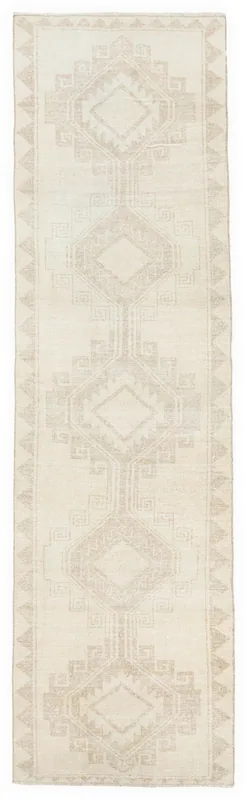 Full overhead view of the vintage Anatolian runner rug on a white background