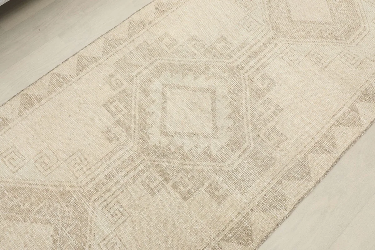Close-up detail of a central geometric medallion pattern and texture