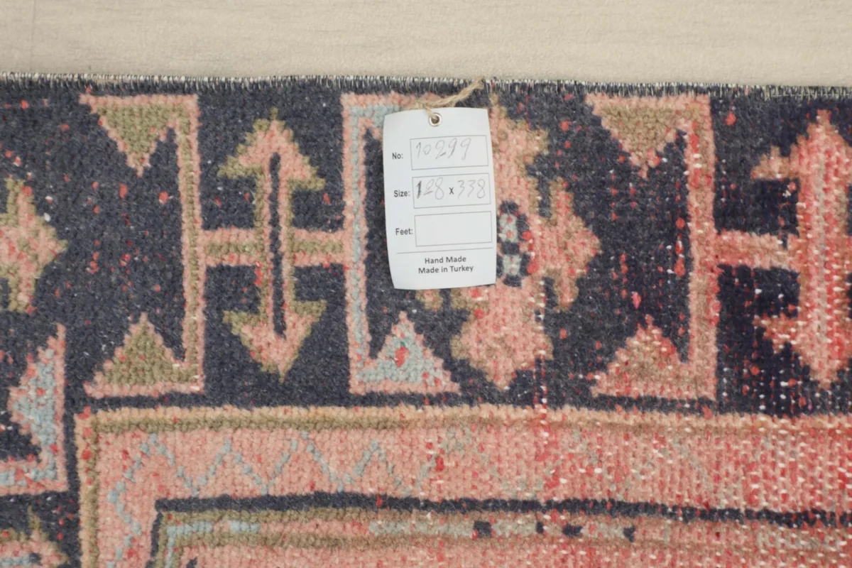 Close-up of the rug's reverse side, showing the hand-knotted wool on cotton foundation