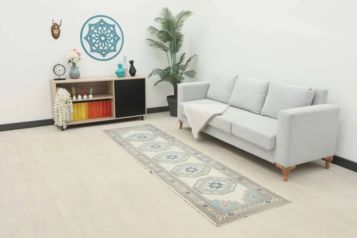 Vintage runner rug displayed in a bright modern living space with a couch