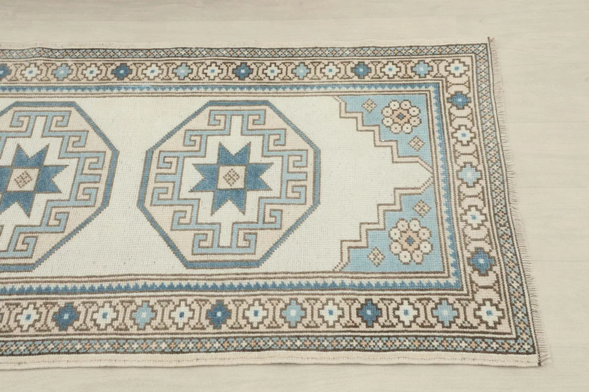 Close-up of one end of the runner, showing geometric patterns and border details