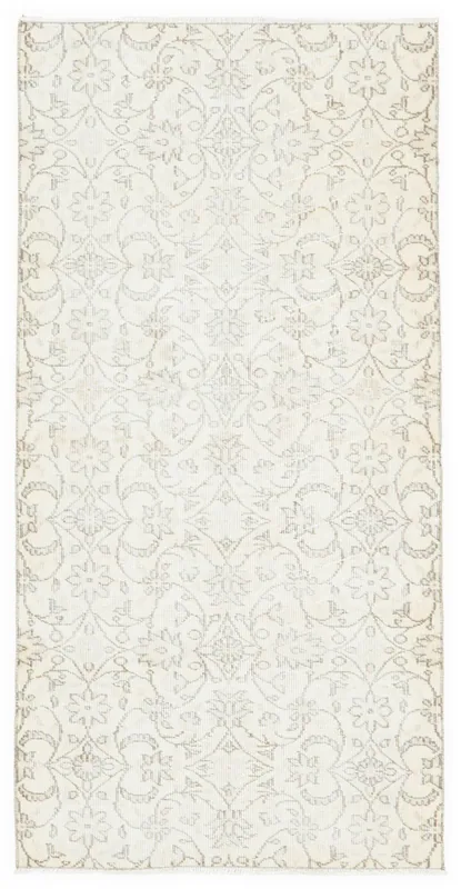 Full overhead view of the beige and gray vintage Anatolian wool rug on a white background.