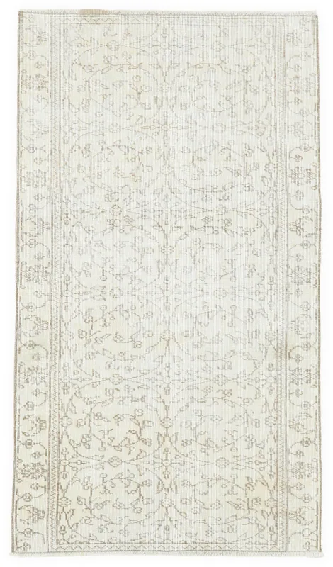 Full overhead view of the 3'3" x 5'8" ivory and tan vintage Anatolian area rug with floral pattern