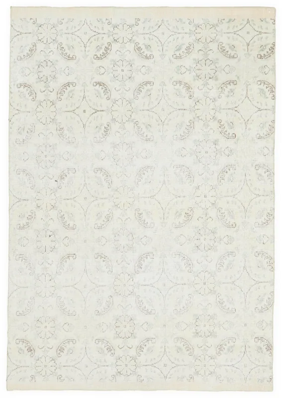 Full overhead view of the 4'8" x 6'8" hand-knotted vintage Anatolian rug with cream field and floral patterns.