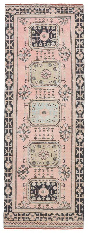 Full top view of the vintage pink and navy geometric Anatolian runner on a white background