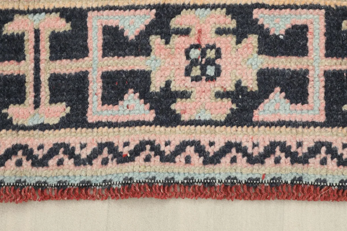 Detailed shot of the navy border and the fringe, revealing the intricate tribal patterns