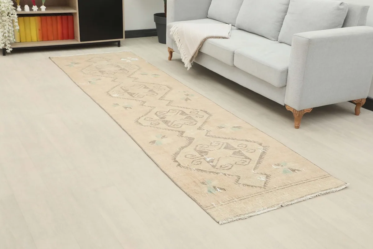 Angled view of the runner rug in a room, showing its length and pattern in context