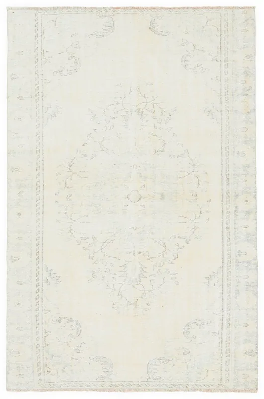 Full top view of the 5'5" x 8'3" ivory and gray vintage Anatolian wool rug
