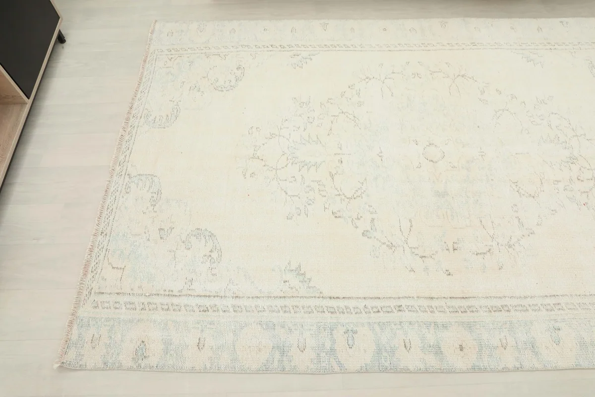 Angled shot of the rug's surface, revealing the subtle variations in color and pattern
