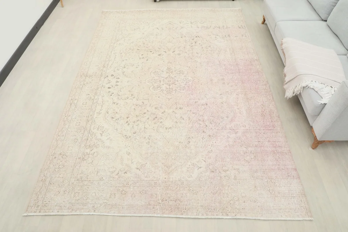 Full view of the 6'11" x 9'11" vintage rug laid out in a modern living space