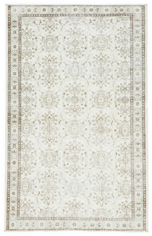 Full top view of the 5'4" x 8'8" ivory and brown geometric vintage Anatolian rug