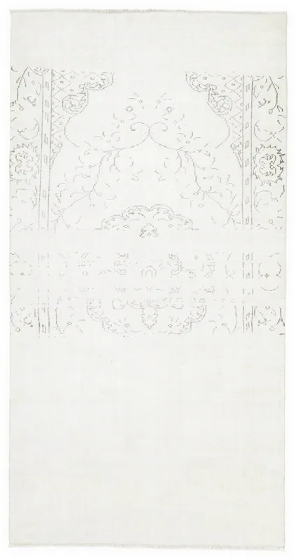 Full top view of the 5'3" x 10'0" ivory and gray vintage Anatolian rug