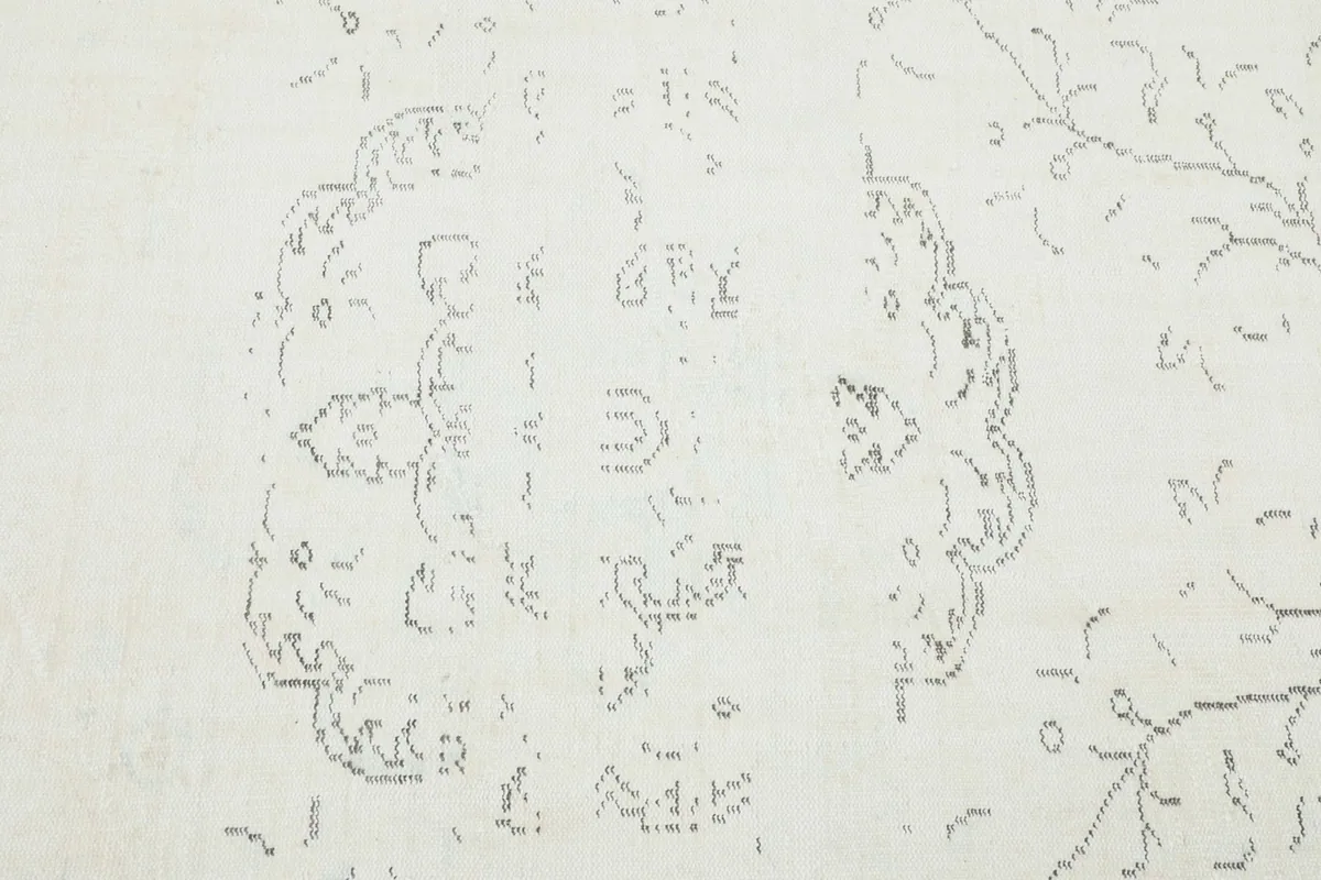 Close-up detail of the central gray geometric medallion design