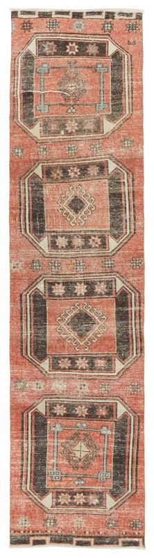 Full overhead view of the rust and charcoal geometric Anatolian runner on a white background.